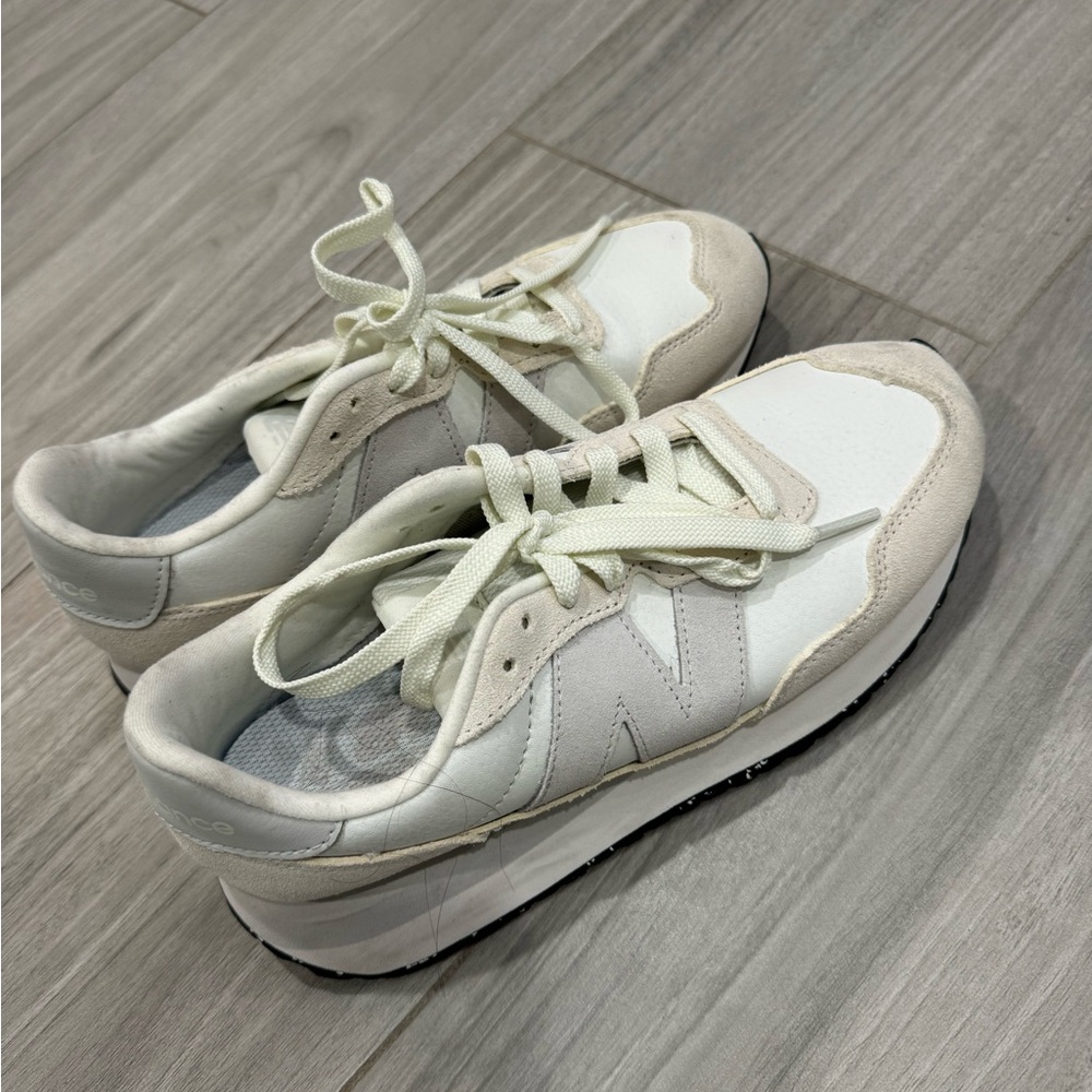 New Balance shoes Size 8. It is white/grey. In great condition, worn two times!